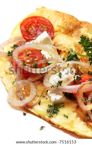 Omelette with cherry tomatoes, grilled red onion, goat\'s cheese, mozzarella and herbs.  A delicious breakfast or brunch.