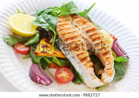 Salmon steak with roasted vegetables and spinach salad.  Delicious, nutritious eating.
