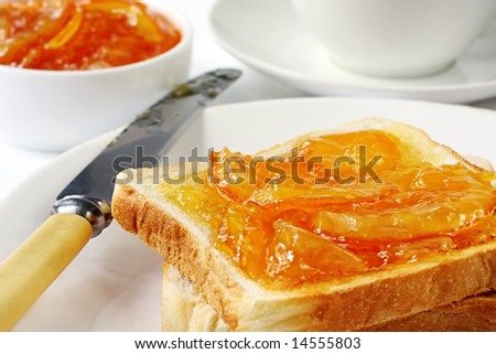 Toast with home-made orange marmalade, served with a cup of tea.