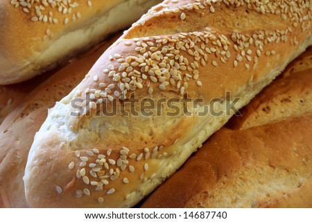 Bread sticks with sesame seeds.  Full-frame close-up.