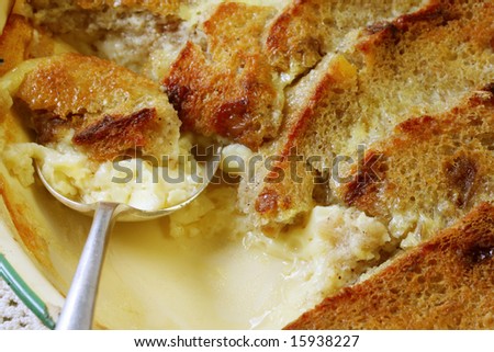 Traditional dessert ~ bread and butter pudding.  Delicious egg custard baked with fruit bread.