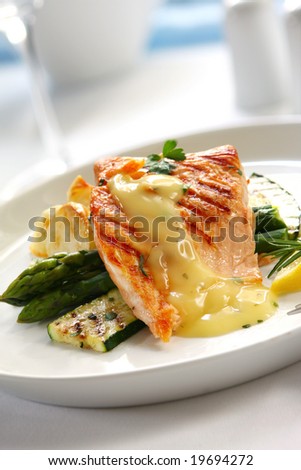 Atlantic salmon, with bearnaise sauce, over roasted potatoes, asparagus and grilled courgette.