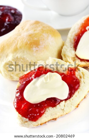 Fresh scones with strawberry jam and fresh cream, served with a cup of tea.  Known as a Devonshire tea or cream tea.
