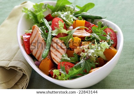 Chicken salad with roasted vegetables and mixed greens.  Delicious healthy eating.