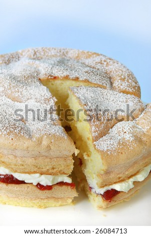 Home-baked sponge cake, filled with strawberry jam and fresh cream.  Delicious!
