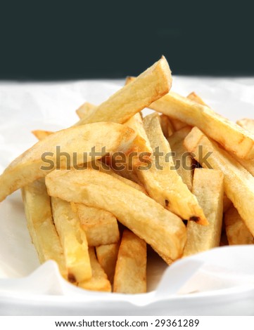 Home-fried potato chips or french fries, hot and ready to eat.