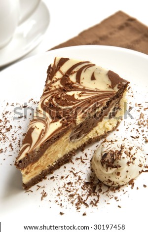 Chocolate marble cheesecake with cream and shaved chocolate
