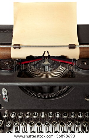 Vintage typewriter with sheet of old blank yellowing paper.
