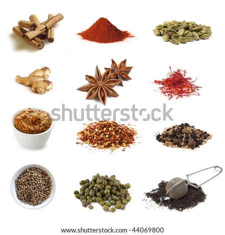 Collection of spices, isolated on white.  Includes cinnamon, paprika, cardamom, ginger, star anise, saffron, mustard, chili flakes, pickling spices, coriander, capers, and black tea.