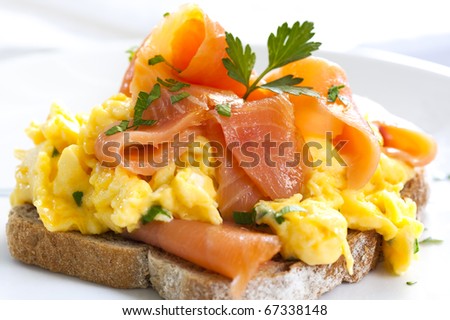 Scrambled eggs with smoked salmon, on sourdough toast.