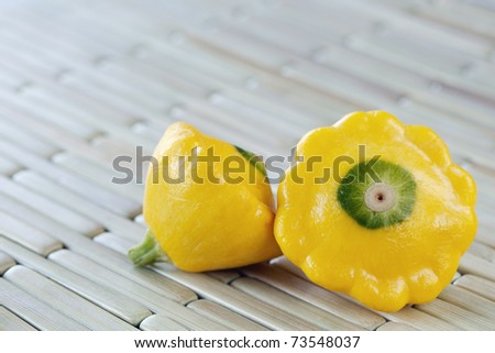 Small yellow summer squash, also known as patty pan squash.