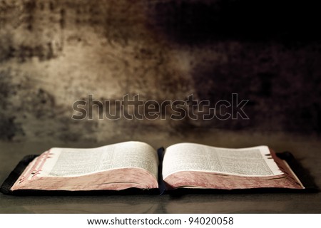 Open Bible, with textured granite background.