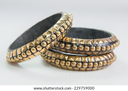 Rock style braided leather and Gold bracelet isolated on white background