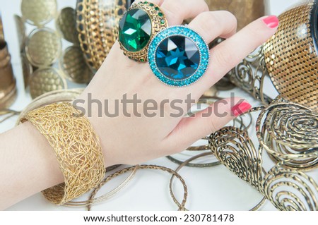 Beautiful rings and bangles on hand.Expensive Gold Jewelry background