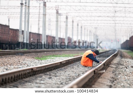 Worker at railway. Railroad worker