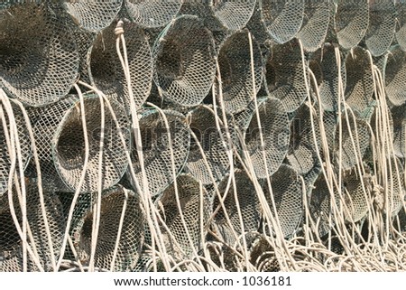 Stack of lobster pots that have been brought home by fishermen in Sardinia