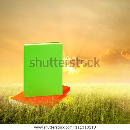 Color Books in grass fields and sunset