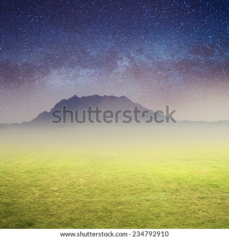 Green grass fields big mountain and Star night