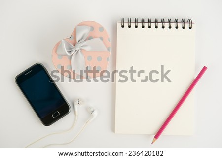 Heart gift box  phone and notebook on  white background