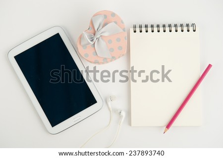 Heart gift box tablet and note book pen on white background