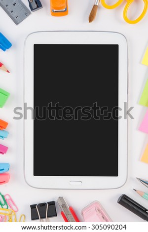 Blank tablet phone  and school or office tools  on white background