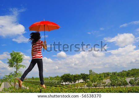 Red umbrella woman in flora park Thailand