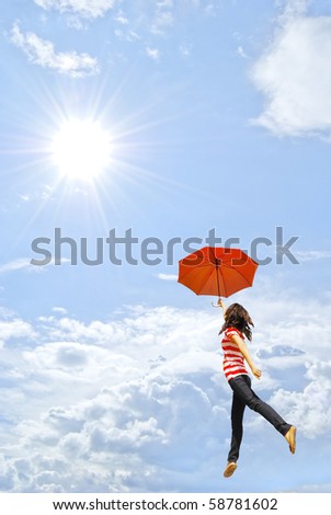 Red umbrella woman against  sunlight