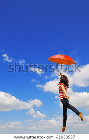 Red umbrella woman jump to sky