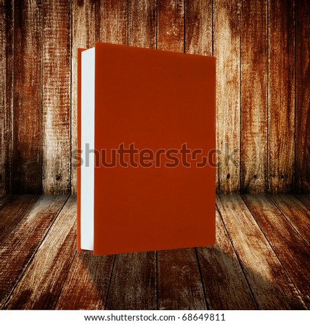 Book on wood floor and wall