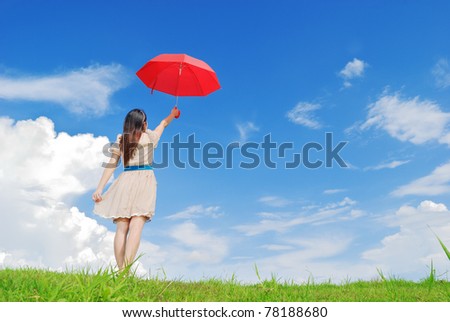 Woman holding red umbrella and cloud sky