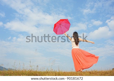 Red umbrella woman standing and cloud sky