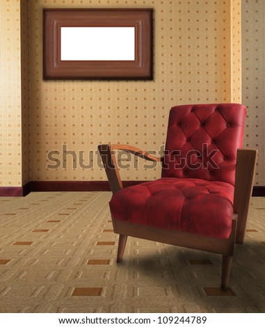 red arm chair in living room with picture frame on wall