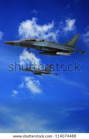 military air plane flying on blue sky and land ground below