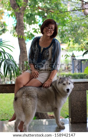 woman and siberian husky dog