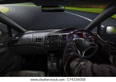 inside view of man driving passenger car on sharp curve mountain high way with carefully
