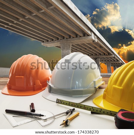 bridge crossing road junction and civil engineer working table use for urban infra structure and government  development topic and civil engineering ,real estate topic
