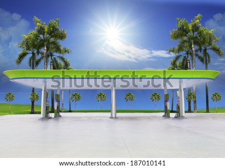 beautiful oil fuel gasoline service station under conception green and eco nature with clear blue ocean and sun shining on sky
