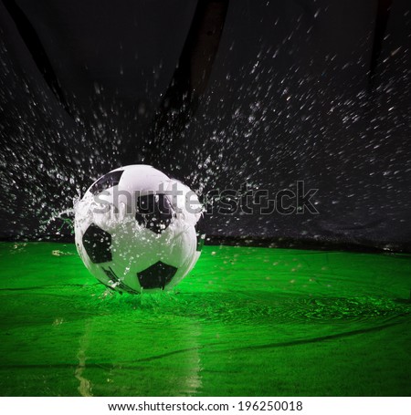 soccer football on splashing water use for sport ball equipment background