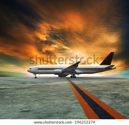 jet plane flying over runways and beautiful dusky sky with copy space use for air transport ,journey and traveling industry business