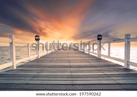 old wood bridge pier with nobody against beautiful dusky sky use for natural background ,backdrop and multipurpose sea scene