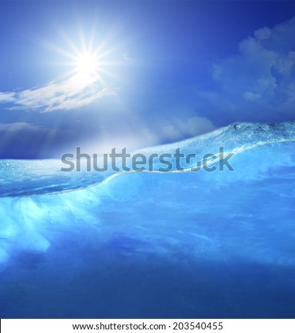 under clear sea blue water with sun shining on sky above use for ocean nature background