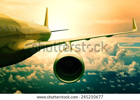 passenger jet plane flying  above cloud scape use for aircraft transportation and traveling business background