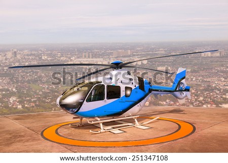 helicopter parking on building roof top use for commercial air transportation and aviation traveling