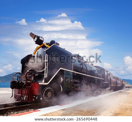 steam locomotive trains in railways station platform preparing to moving to traveling against beautiful blue and cloudy sky