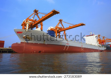 commercial ship floating in   ship yard loading container use for vessel and water transport ,logistic ,import export industry