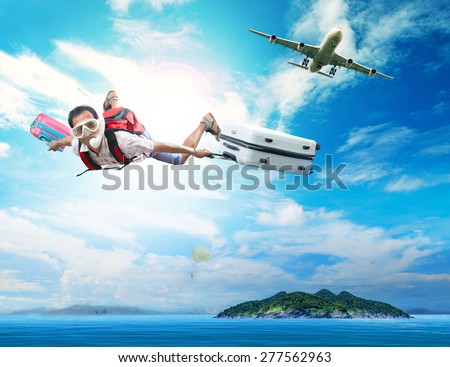 young man flying on blue sky wearing snorkeling mask and holding luggage use for people traveling by plane to destination sea island and summer vacation holiday theme