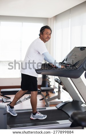 senior man 59s years old in fitness club use for old people and healthy lifestyle