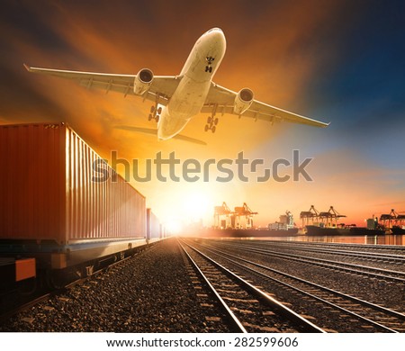 industry container trainst running on railways track plane cargo flying above and ship transport in import export container yard