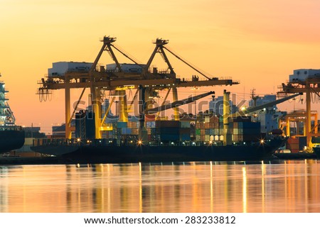 beautiful of morning light in ship port loading container goods in import ,export and logistic transport industry