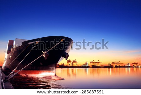 container ship in import,export port against beautiful morning light of loading ship yard use for freight and cargo shipping vessel transport